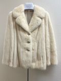 Blush mink jacket front view with notch collar and tortoiseshell buttons