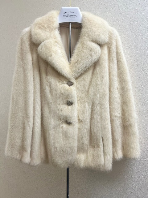 Blush mink jacket front view with notch collar and tortoiseshell buttons