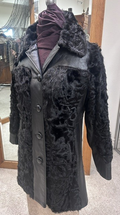 Front of vintage black Spanish lamb fur coat #1767 with leather panels and button closure