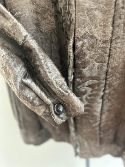 Pre-owned brown dyed broadtail jacket, sleeve and button cuff detail